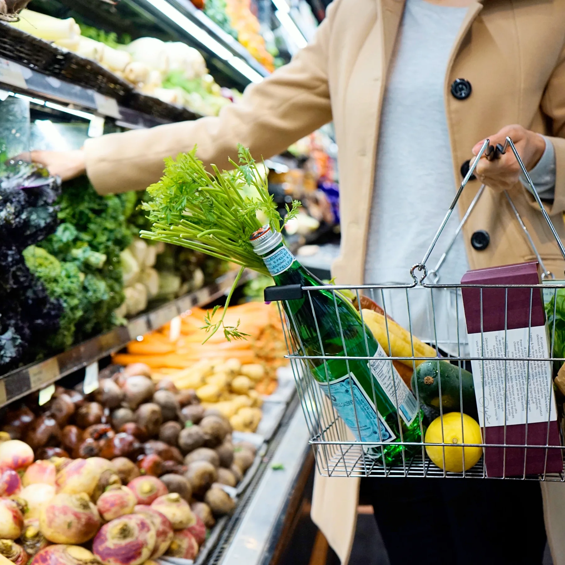 A shopping cart filled with everyday groceries